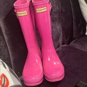 Bright pink rain boots